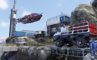A block-built drilling rig, a six-wheeled rover and a small red spacecraft parked on a rocky cliff under a blue sky, with an engineer in a suit nearby.